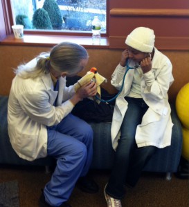 Denisse and Dr. Doolen examine a bird together